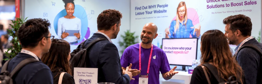DLYTE speaking with business attendees at an expo booth