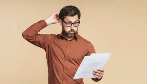 Customer looking confused while reading an invoice