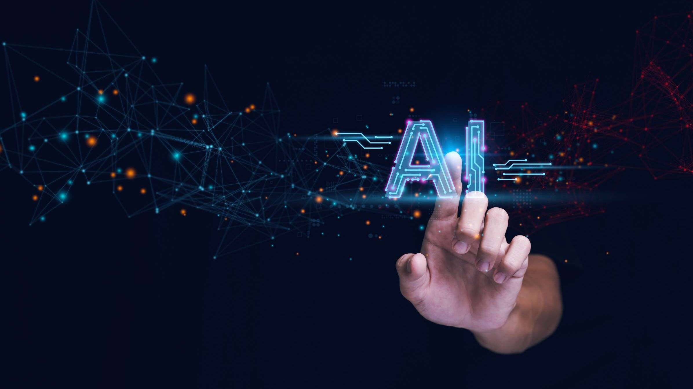 Hand reaching toward a glowing 'AI' text surrounded by a network of digital nodes and glowing points, symbolizing artificial intelligence and connectivity.